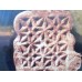 Geometric carved tombstone fragment